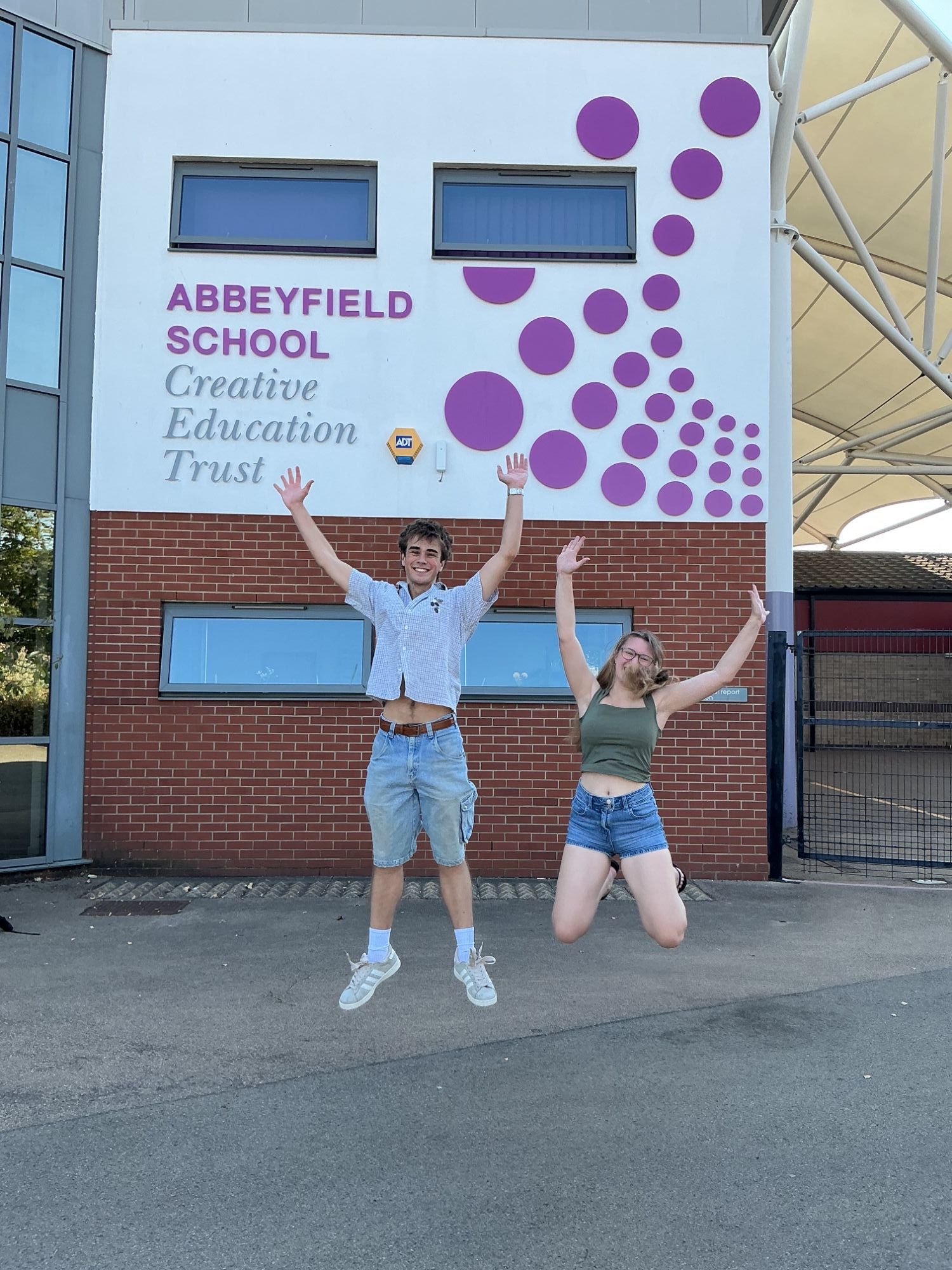 Photo of students celebrating on A Level Results Day